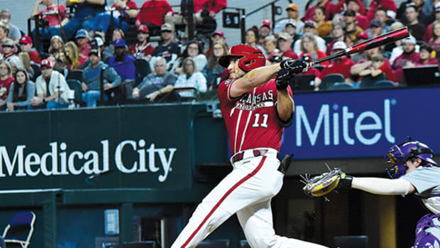 Jared Wegner blasts a shot to deep left center for a home run in the first inning against TCU at Globe Life Field.